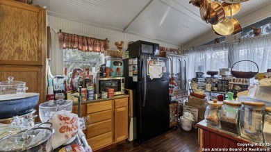 Nestled in a serene setting, this classic rustic home in the on Canyon Lake Golf Club in Texas - for sale on GolfHomes.com, golf home, golf lot