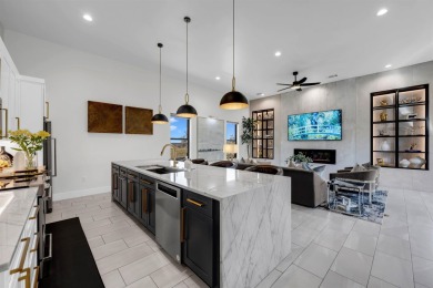 Welcome to 711 Twin Sails, where stunning views of Lake LBJ on Slick Rock Golf Course - Horseshoe Bay in Texas - for sale on GolfHomes.com, golf home, golf lot