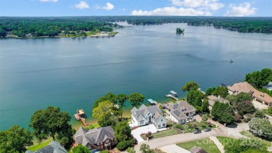 Indulge in lakeside luxury within this meticulously renovated on Tega Cay Golf Club in South Carolina - for sale on GolfHomes.com, golf home, golf lot