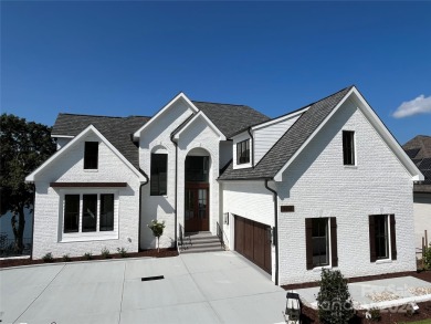 Indulge in lakeside luxury within this meticulously renovated on Tega Cay Golf Club in South Carolina - for sale on GolfHomes.com, golf home, golf lot