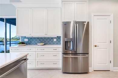 This stunning southern-exposure end unit offers some of the most on West Bay Beach and Golf Club in Florida - for sale on GolfHomes.com, golf home, golf lot