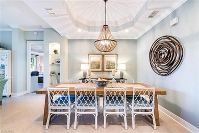 This stunning southern-exposure end unit offers some of the most on West Bay Beach and Golf Club in Florida - for sale on GolfHomes.com, golf home, golf lot