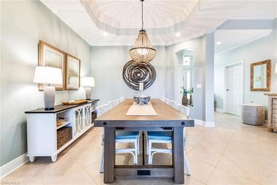 This stunning southern-exposure end unit offers some of the most on West Bay Beach and Golf Club in Florida - for sale on GolfHomes.com, golf home, golf lot