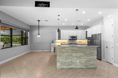 Gorgeous single story 3 bedroom 2 bath home w/custom pool/spa on Parkland Golf Club in Florida - for sale on GolfHomes.com, golf home, golf lot