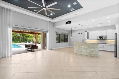 Gorgeous single story 3 bedroom 2 bath home w/custom pool/spa on Parkland Golf Club in Florida - for sale on GolfHomes.com, golf home, golf lot