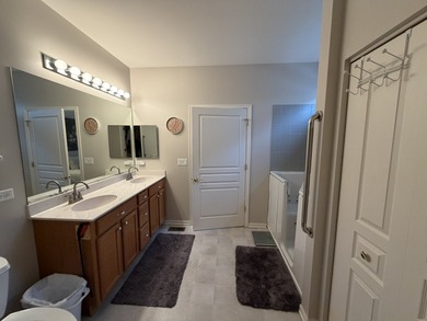 Delightful, sun-filled ranch with a finished basement nestled in on Carillon Lakes 3 Hole Course in Illinois - for sale on GolfHomes.com, golf home, golf lot