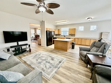 Delightful, sun-filled ranch with a finished basement nestled in on Carillon Lakes 3 Hole Course in Illinois - for sale on GolfHomes.com, golf home, golf lot