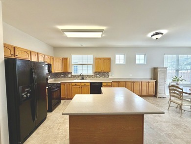 Delightful, sun-filled ranch with a finished basement nestled in on Carillon Lakes 3 Hole Course in Illinois - for sale on GolfHomes.com, golf home, golf lot