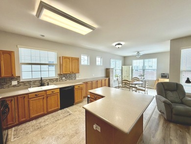 Delightful, sun-filled ranch with a finished basement nestled in on Carillon Lakes 3 Hole Course in Illinois - for sale on GolfHomes.com, golf home, golf lot