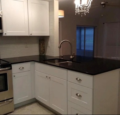 Welcome to this beautifully updated 2-bedroom, 2-bath condo on Seven Springs Golf and Country Club in Florida - for sale on GolfHomes.com, golf home, golf lot