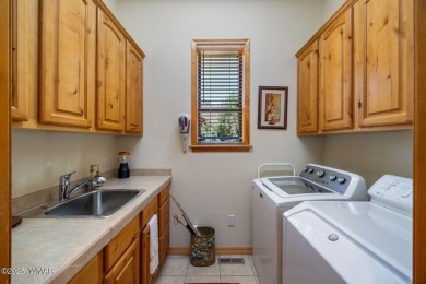 Overlooking the lush fairways and a tranquil water feature of on Torreon Golf Club in Arizona - for sale on GolfHomes.com, golf home, golf lot