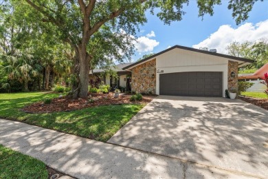 Under contract-accepting backup offers. This gorgeous Coastal on East Lake Woodlands Country Club in Florida - for sale on GolfHomes.com, golf home, golf lot