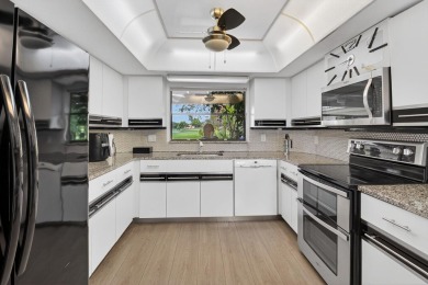 Beautiful two-story home located in the desirable 55+ community on Indian Spring Golf and Country Club in Florida - for sale on GolfHomes.com, golf home, golf lot