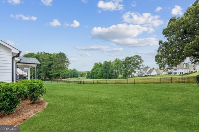 Imagine waking up to stunning views of the green, enjoying your on Traditions of Braselton Golf Club in Georgia - for sale on GolfHomes.com, golf home, golf lot