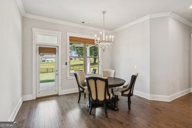 Imagine waking up to stunning views of the green, enjoying your on Traditions of Braselton Golf Club in Georgia - for sale on GolfHomes.com, golf home, golf lot