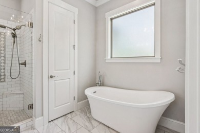 Imagine waking up to stunning views of the green, enjoying your on Traditions of Braselton Golf Club in Georgia - for sale on GolfHomes.com, golf home, golf lot