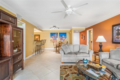 This corner lakefront condo offers a blend of resort-style on Ocean Village Golf Course in Florida - for sale on GolfHomes.com, golf home, golf lot