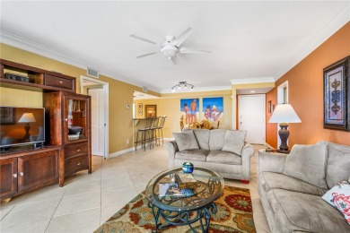 This corner lakefront condo offers a blend of resort-style on Ocean Village Golf Course in Florida - for sale on GolfHomes.com, golf home, golf lot