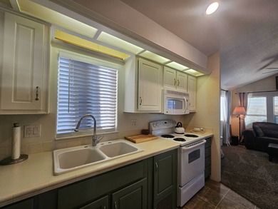 This home is a true delight inside and out! It features an open on Viewpoint Golf Resort in Arizona - for sale on GolfHomes.com, golf home, golf lot