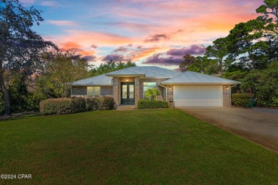 Nestled on an oversized lot, this single-level brick home in on Santa Rosa Golf and Beach Club in Florida - for sale on GolfHomes.com, golf home, golf lot