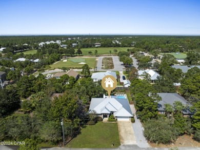 Nestled on an oversized lot, this single-level brick home in on Santa Rosa Golf and Beach Club in Florida - for sale on GolfHomes.com, golf home, golf lot