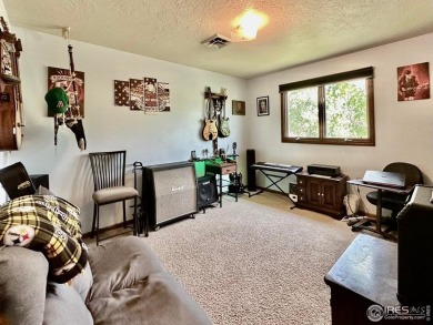 Step into resort-style living with this stunning 5 bedroom, 4 on Highland Hills Golf Course in Colorado - for sale on GolfHomes.com, golf home, golf lot