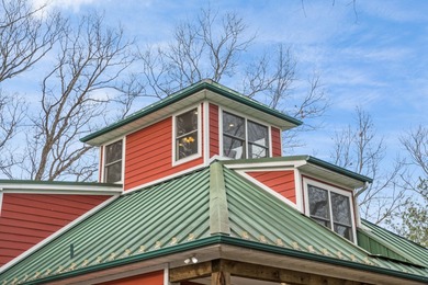 Discover elevated mountain living at 175 Cub Lane, a refined on Woodstone Meadows Golf Course At Massanutten in Virginia - for sale on GolfHomes.com, golf home, golf lot