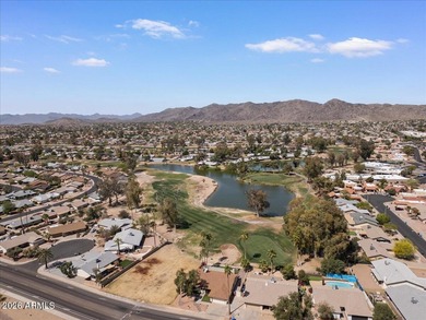 Beautifully situated on the 13th green of the scenic Ahwatukee on Ahwatukee Country Club in Arizona - for sale on GolfHomes.com, golf home, golf lot
