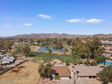 Beautifully situated on the 13th green of the scenic Ahwatukee on Ahwatukee Country Club in Arizona - for sale on GolfHomes.com, golf home, golf lot