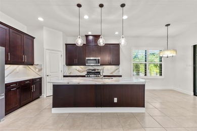 Welcome to 5242 Napoli Run, an exceptional residence located in on Esplanade Golf and Country at Lakewood Ranch in Florida - for sale on GolfHomes.com, golf home, golf lot