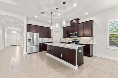 Welcome to 5242 Napoli Run, an exceptional residence located in on Esplanade Golf and Country at Lakewood Ranch in Florida - for sale on GolfHomes.com, golf home, golf lot