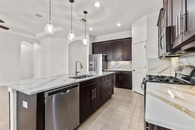 Welcome to 5242 Napoli Run, an exceptional residence located in on Esplanade Golf and Country at Lakewood Ranch in Florida - for sale on GolfHomes.com, golf home, golf lot