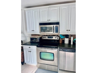 Beautiful corner unit1 bedroom 1 bath, first floor.  concrete on Ocean Village Golf Course in Florida - for sale on GolfHomes.com, golf home, golf lot