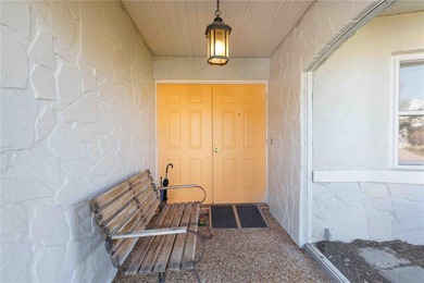 Experience quintessential Florida living in this spacious on Village Green Golf Club of Sarasota in Florida - for sale on GolfHomes.com, golf home, golf lot