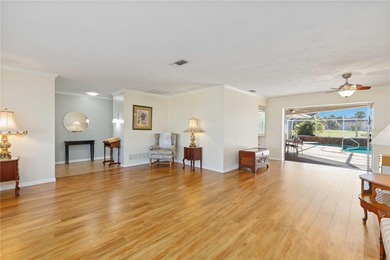 Experience quintessential Florida living in this spacious on Village Green Golf Club of Sarasota in Florida - for sale on GolfHomes.com, golf home, golf lot