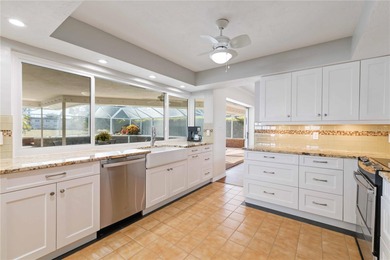 Experience quintessential Florida living in this spacious on Village Green Golf Club of Sarasota in Florida - for sale on GolfHomes.com, golf home, golf lot