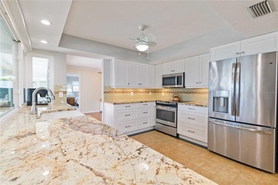 Experience quintessential Florida living in this spacious on Village Green Golf Club of Sarasota in Florida - for sale on GolfHomes.com, golf home, golf lot