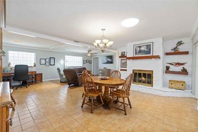 Experience quintessential Florida living in this spacious on Village Green Golf Club of Sarasota in Florida - for sale on GolfHomes.com, golf home, golf lot