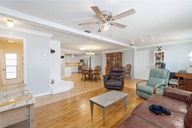 Experience quintessential Florida living in this spacious on Village Green Golf Club of Sarasota in Florida - for sale on GolfHomes.com, golf home, golf lot