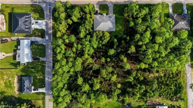 Build your dream on this oversized half-acre lot in the growing on Lehigh Resort Club in Florida - for sale on GolfHomes.com, golf home, golf lot
