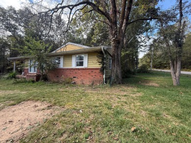 This 3-bedroom, 2-bath home sits on a large corner lot and on Cherokee Village North Course in Arkansas - for sale on GolfHomes.com, golf home, golf lot