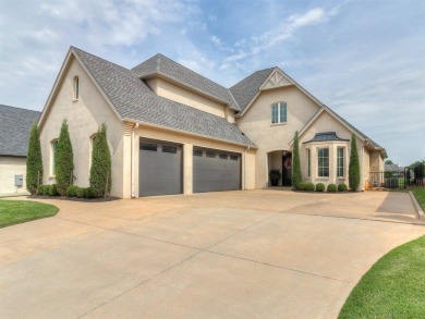 Nestled within the prestigious Oak Tree Golf and Country Club on Oak Tree National Golf and Country Club in Oklahoma - for sale on GolfHomes.com, golf home, golf lot