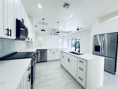 Welcome to this beautifully, fully renovated home, featuring a on Riverwood Golf Club in Florida - for sale on GolfHomes.com, golf home, golf lot