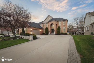 Discover luxurious lakefront living in this beautifully on Indianwood Golf and Country Club in Michigan - for sale on GolfHomes.com, golf home, golf lot