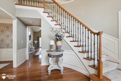 Discover luxurious lakefront living in this beautifully on Indianwood Golf and Country Club in Michigan - for sale on GolfHomes.com, golf home, golf lot