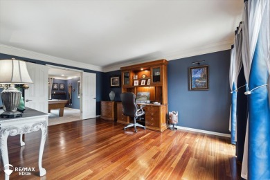 Discover luxurious lakefront living in this beautifully on Indianwood Golf and Country Club in Michigan - for sale on GolfHomes.com, golf home, golf lot