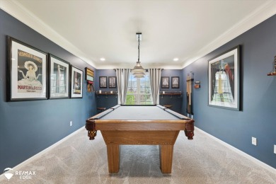 Discover luxurious lakefront living in this beautifully on Indianwood Golf and Country Club in Michigan - for sale on GolfHomes.com, golf home, golf lot