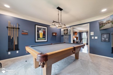 Discover luxurious lakefront living in this beautifully on Indianwood Golf and Country Club in Michigan - for sale on GolfHomes.com, golf home, golf lot