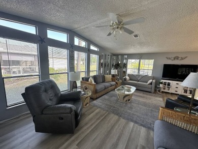 Lot Rent for this home is $1,342.00/monthly. Beautiful stucco on Del Tura Golf and Country Club in Florida - for sale on GolfHomes.com, golf home, golf lot