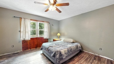 Nestled on 5 peaceful, wooded acres, this charming 2-bedroom on Wind River Golf Course in Tennessee - for sale on GolfHomes.com, golf home, golf lot